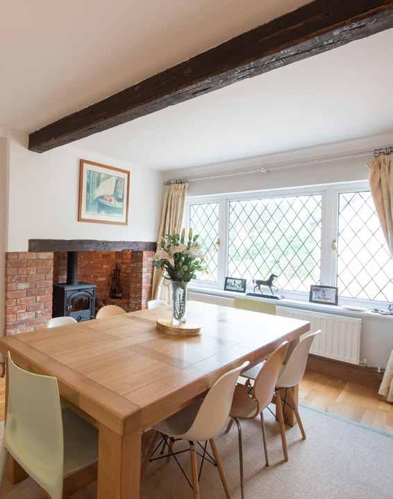 Stylish Entertaining Rounding the corner on a quiet country lane there is an archway cut into a full height hedge where wooden electric gates open to reveal a large expanse of gravel with ample