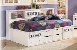set with photos or other materials Decorative lattice overlays accent panels on top drawers, beds, and mirror Bedside bookcase is a modernized day bed