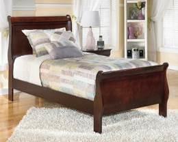 B376 Alisdair (Signature Design) Made with select hardwood solids and veneers in a warm dark brown finish Louis Philippe styling with sleigh shaped headboard and footboard Antique bronze color