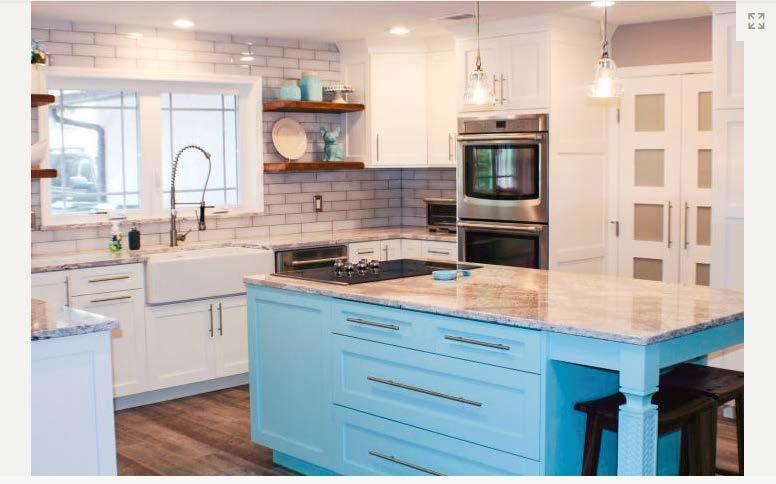 Changing the color of cabinets can breathe new life into a drab kitchen space. Paint the lower cabinets one color and keep the upper cabinets neutral for a clean, balanced look.