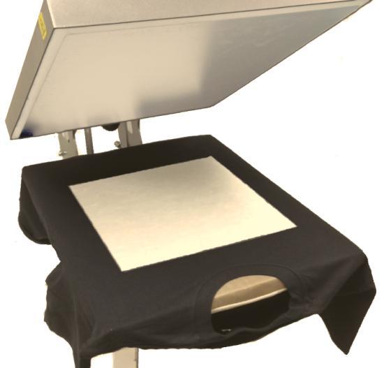 6. Place the Pretreat Paper Platen with the pad side of the platen faces up and the metal side faces down on the