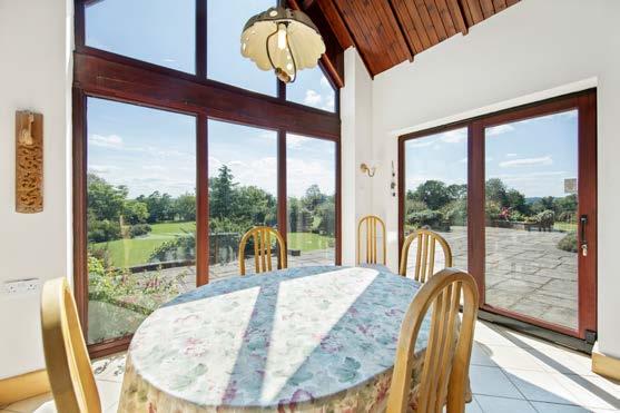 From here are three formal reception rooms along with the vaulted kitchen/breakfast room with its stunning floor to ceiling windows overlooking the