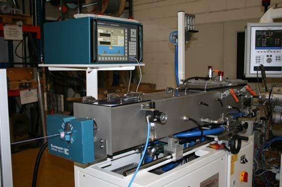 Laser measuring head for x- and y-axis with display and control unit Haul-off-cutting device A belt haul-off with two electronically synchronized servo motors, operating the respective belt carrier
