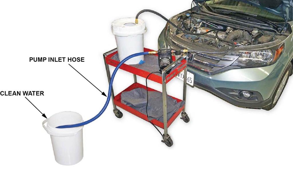 12. Clean the CLR solution from the heater core by flushing it with 30 gallons of clean tap water as follows: Fill the second bucket (provided with the kit) and fill it with clean tap water.