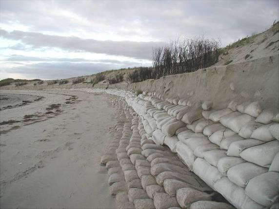 Another important criterion was that the geotextile should provide some form of vandal resistance. The first groyne, which was constructed using 2.5 m 3 containers (Fig. 9), proved to be a success.