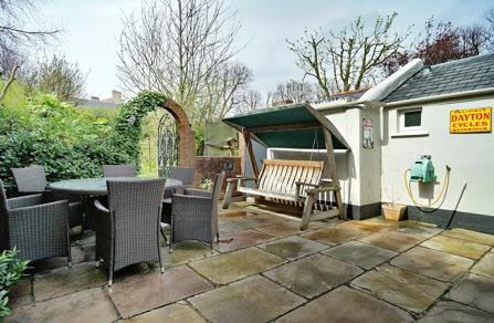 Extensive paved patio - ideal for summer entertainment. Outside tap.
