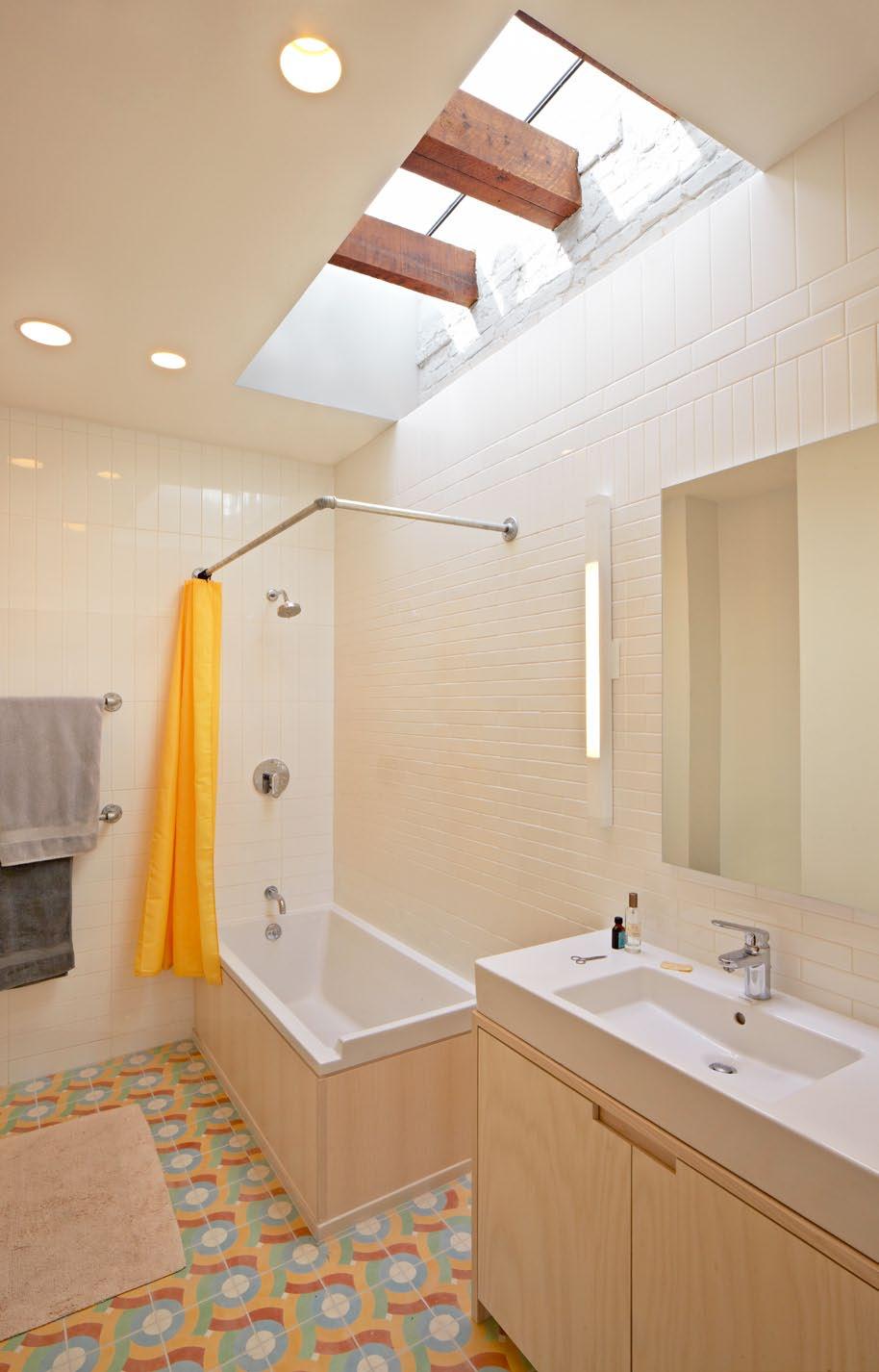 A dramatic skylight in the master bath showcases the original roof