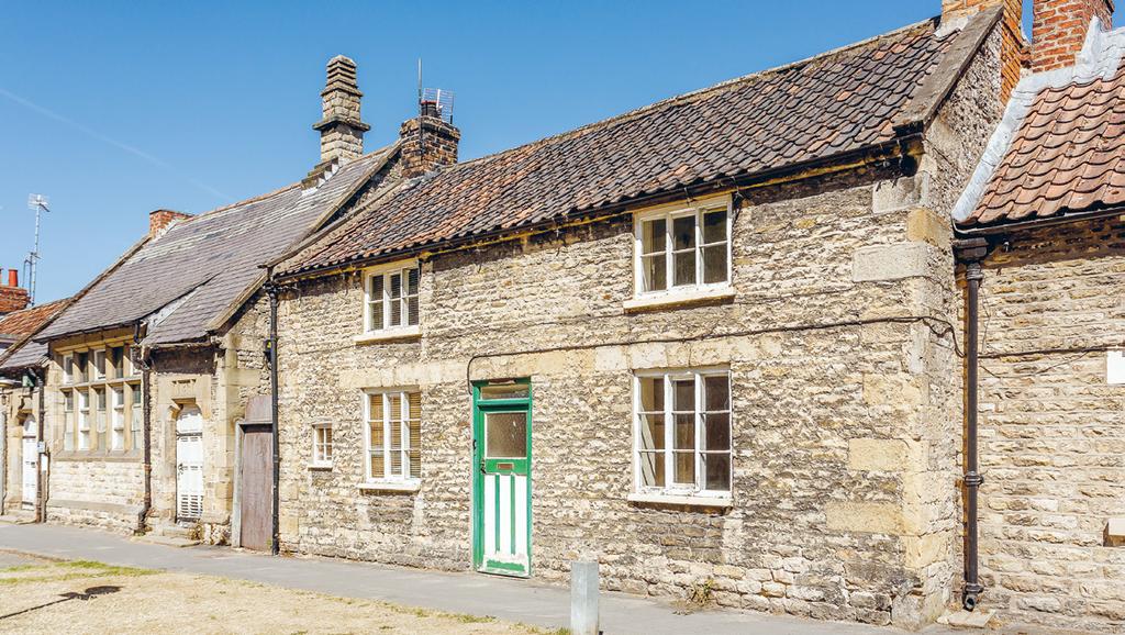 A PRIME DEVELOPMENT OPPORTUNITY AND ATTRACTIVE COTTAGE IN THE CENTRE OF THIS HIGHLY REGARDED