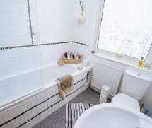with mains fed shower over; low flush W.C.; pedestal wash hand basin; radiator and ceiling light point.