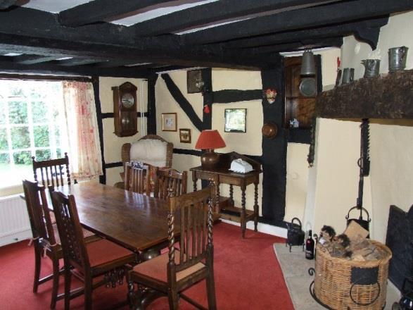 Dining Room measuring approximately 14 6 x 13 3 maximum (4.42m x 4.04m) with a wealth of exposed ceiling and wall timbers.