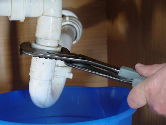 05 Use pliers to disconnect the drainpipe and P-trap from the sink drain. 06 Remove the dishwasher drain line. 07 Remove the disposer following the manufacturer's instructions.