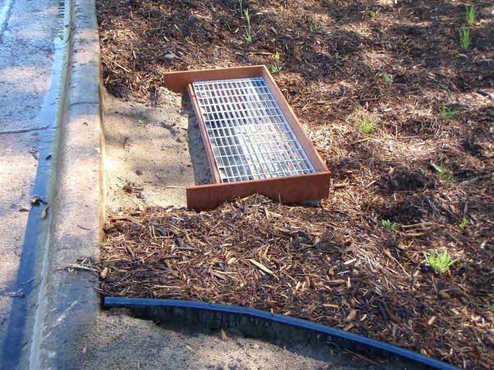 - Fill space between chamber and curb with soil to