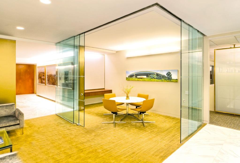 With non conventional door enclosures and floor to ceiling glass panels, the