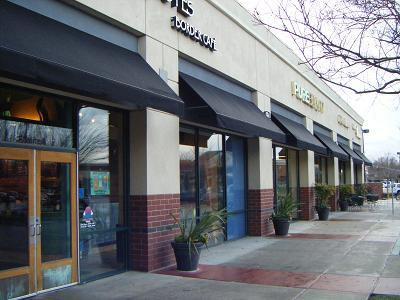 Figure 10: Large windows on this storefront provide an open and inviting feel. Pedestrian scaled design elements, such as planters and canopies, make the building pedestrian friendly. 3.