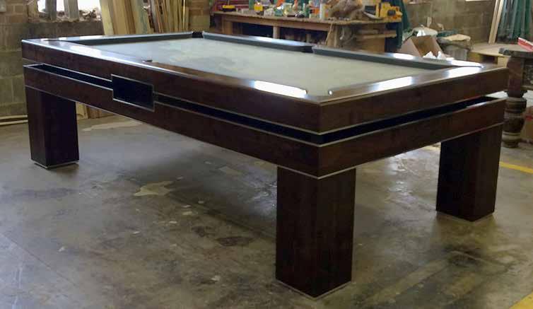 Many tables are dual-purpose some simply rolling-over to transform a sleek dining table into a stylish snooker or pool table others have precision engineered winding mechanisms to lower the table for