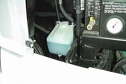 SECTION 3 DRIVING YOUR MOTOR HOME Windshield Washer Reservoir (Located behind front hood panel) -Typical View TIRES Improper tire pressure can result in tire overloading and abnormal wear and also
