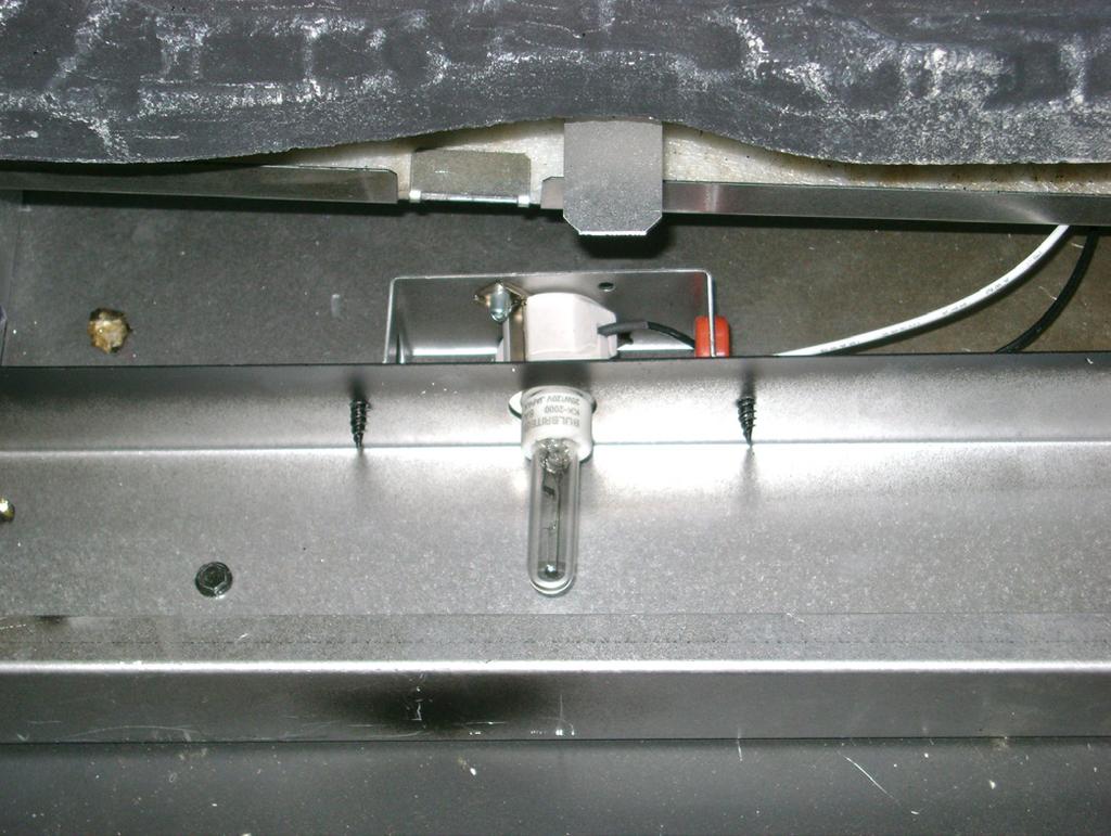 Installing the Optional Heat-Zone Gas Kit 1. Remove the knockout from the side of the appliance and discard it. See Figure 11.8. 2.