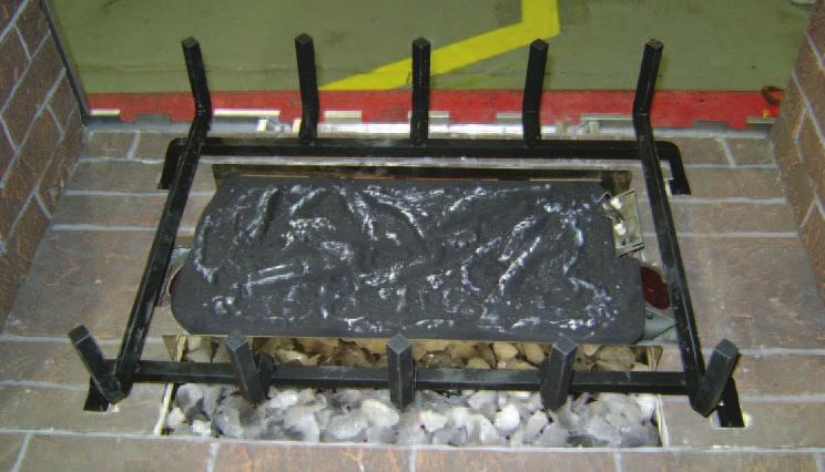 back. Position grate by locating the four indentations on the bottom refractory.