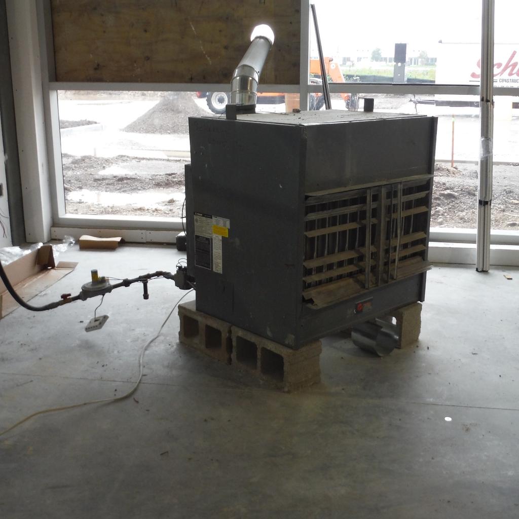 A third type of temporary heater locates the combustion chamber and heat exchanger inside the building, and vents the combustion chamber to the building s exterior (Photo 3).