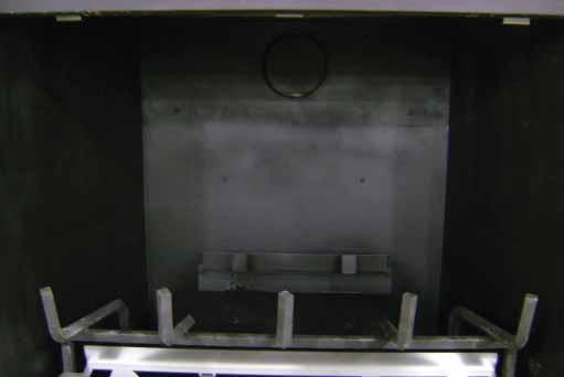 2. Place the back refractory panel against the back of the firebox. Ensure back refractory panel makes full contact with the back wall of the firebox.