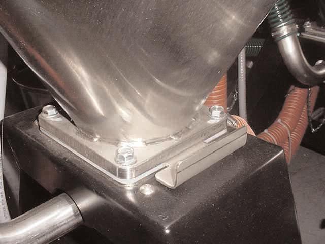 The hopper, spreader cone, and discharge assembly should be cleaned thoroughly between material changes to prevent