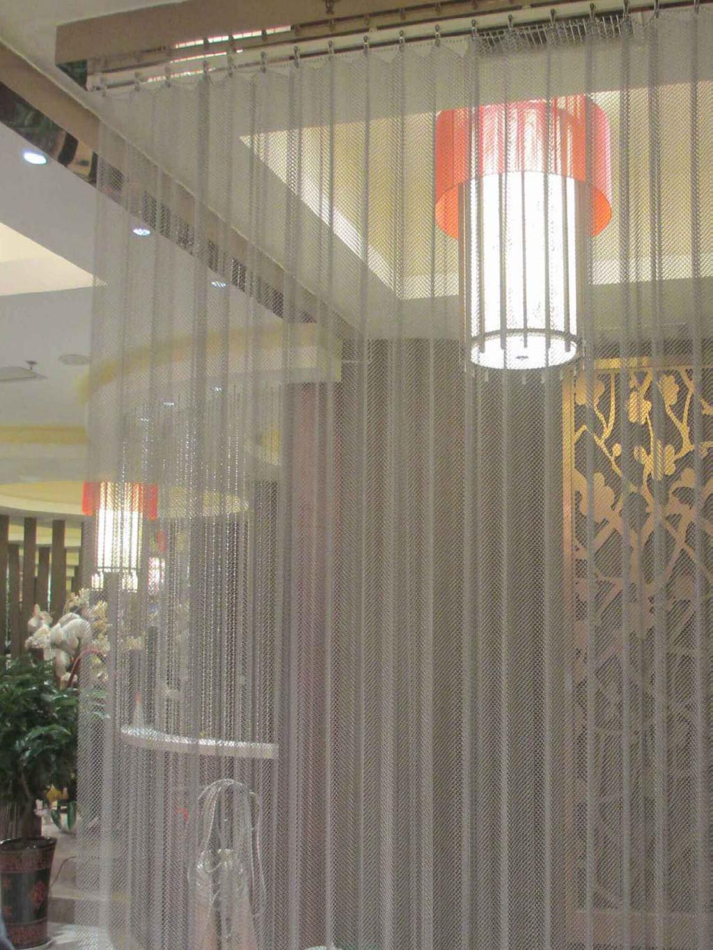 Metal coil drapery - aesthetic appeal Metal coil drapery, a new and innovative decorative metal curtain, has the flexibility and gloss of metal wire and metal line.