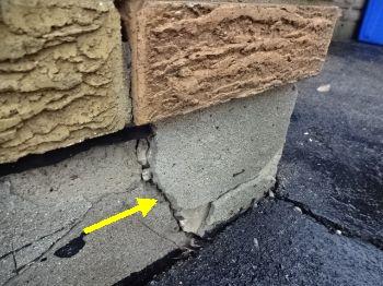 Cement parging is flaking/deteriorated.