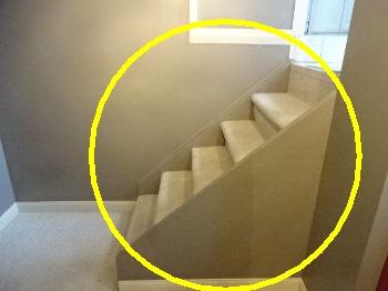 Recommend installing a handrail for safety. Unguarded area on the stairs.