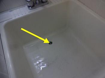The laundry tub drains slow. Recommend cleaning out the drain pipe and trap.