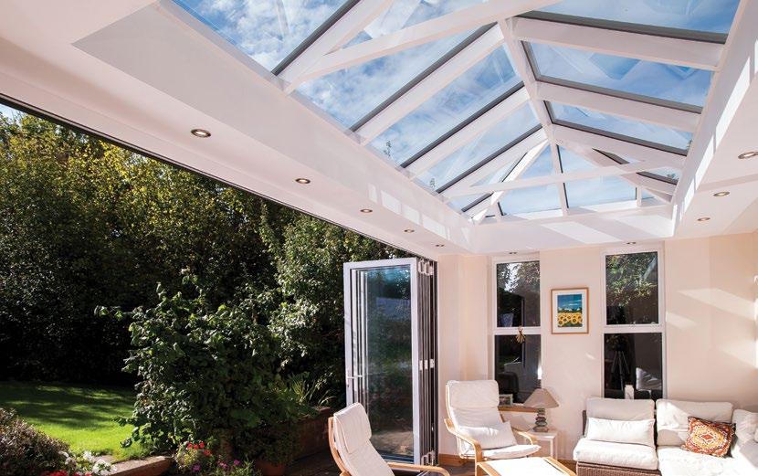 THE LIGHT OF A CONSERVATORY The Skyroom boasts the signature credentials of an Atlas roof subtle roof frame with large expanses of glass.
