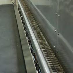 Sequence gates mounted on neck-rail faster loading time for all sizes of cow.