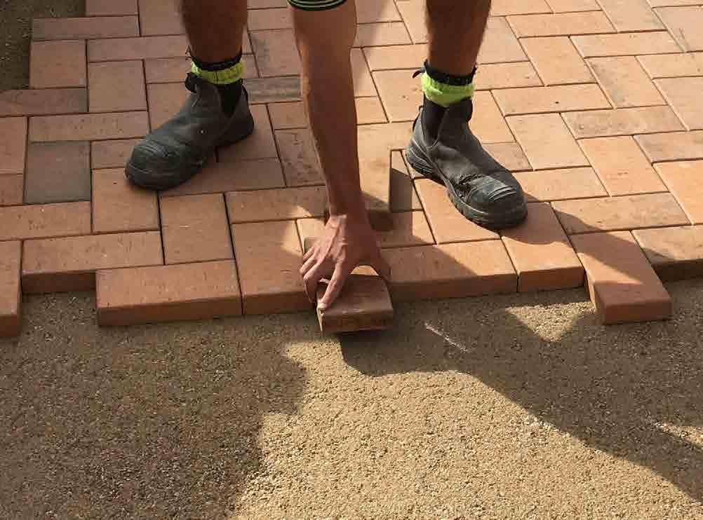 TIPS & TRICKS Use stakes to mark corners of the area to be paved and run a string line between them. The level of the string should be the level at which you want your paving to be.