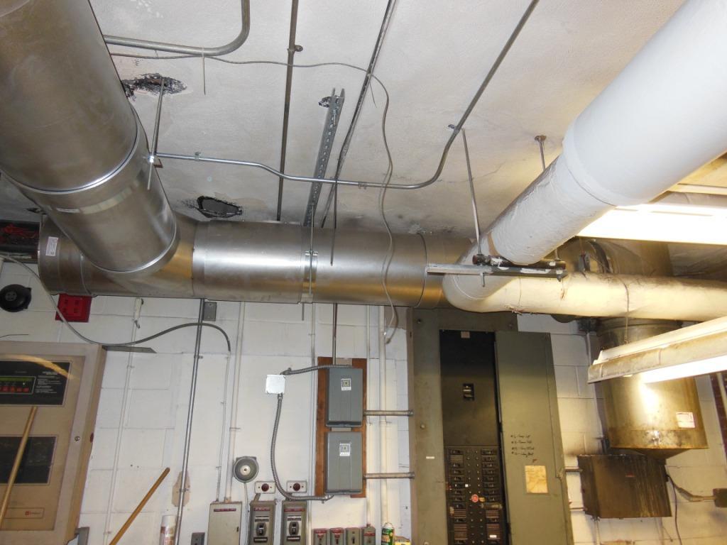 Stainless steel boiler flue vent piping reconnected to