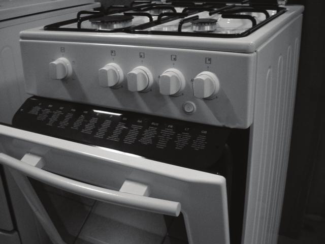 Check oven burner lighting through the slots at the front of the oven bottom and make sure the burner flame remains alight when the knob is released. If it does not, repeat the operation.