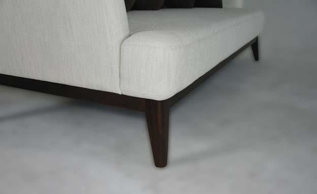 Coupled with the contrast between its dark walnut wood and fabric, it is