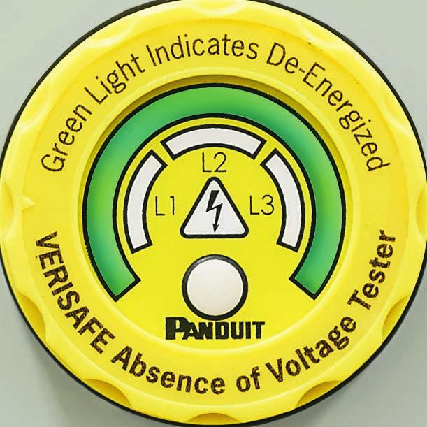 Pressing "TEST" button initiates voltage test, indicated by flashing YELLOW caution indicator.