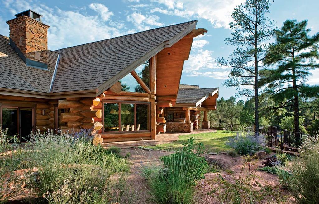 Large handcrafted logs create a home worthy of its rugged setting.