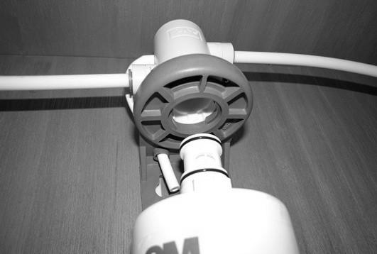 The diverter plug is installed in the same manner as the water filter. Cold Water Filter Assembly (Located below galley sink) NOTE: Hot waterline is not filtered.