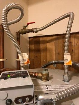 Main water shutoff is located adjacent to water heater in