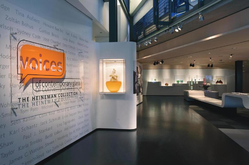 1999 Voices of Contemporary Glass: Introduction lounge Graphic Wall with featured glass work Putti Lounging on Crab Resting on Orange Madder Vessel, 1999, Dale Chihuly.
