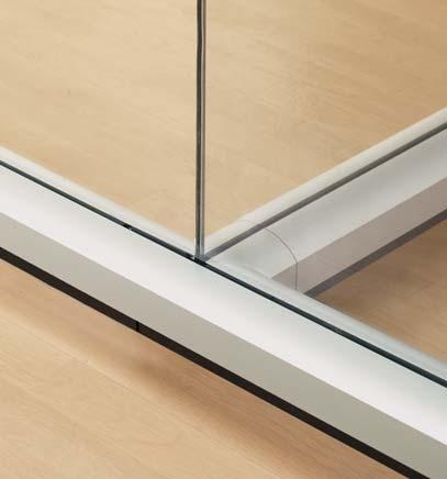 CURVED OPTOS Straight modules of glass join to create faceted glass walls.