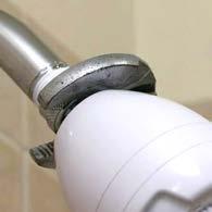 Use the adjustable wrench to remove the old showerhead. 3. Clean the threads to remove old joint sealer. 4. Apply joint sealer or tape, using package instructions (figure 13). 5.