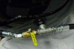 depressurize the dryer system by opening the ball valve on the oil coalescing filter and by