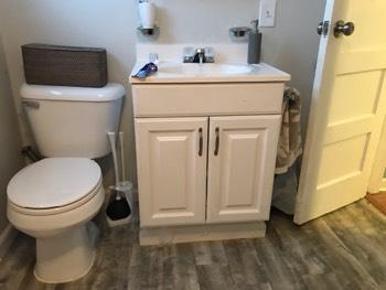 Counters Engineered Composite Vanity Top with Basin 5. Cabinets Cabinet doors are in operable condition overall. 6. Exhaust Fans Vent fan operates overall. 7.