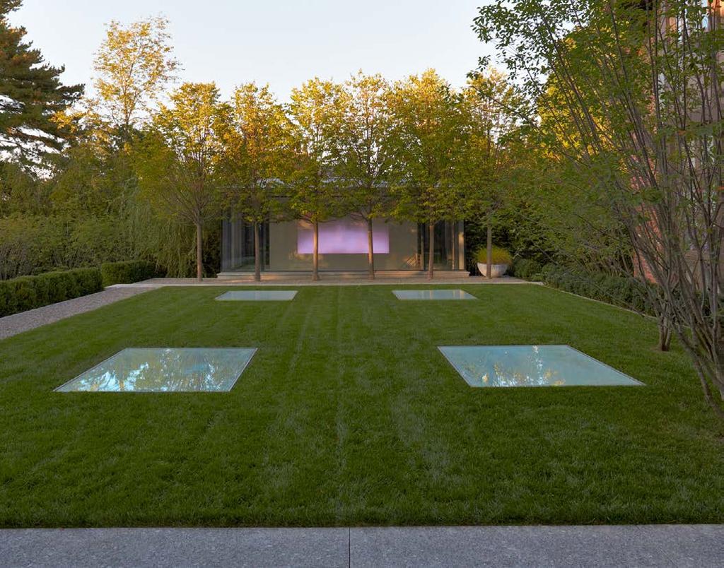 This gallery space was designed to integrate fully into the site, with flush skylights that puncture a lawn panel for entertaining, and a glass head house as a focal point of the garden, that also