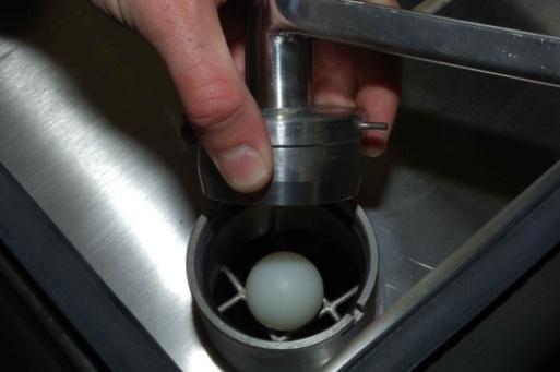 Install the 1 diameter plastic ball into the oil valve housing nearest the front