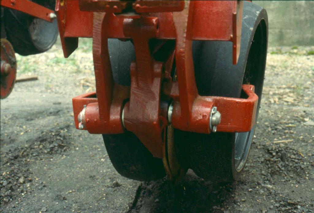 Figure 1. Depth wheels adjacent to seed opener. Objectives The objectives of the research were: 1.