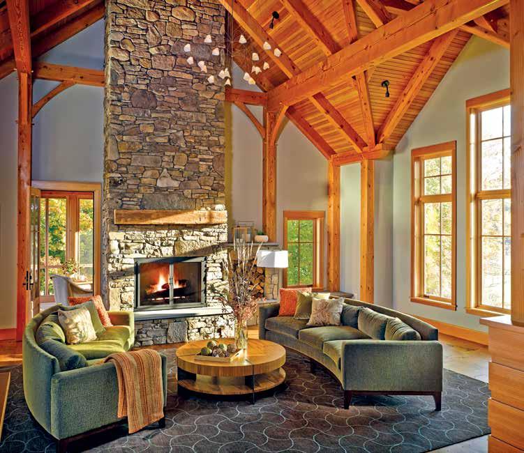 ABOVE: The stone hearth in the gable end of the open great room acts as a double-sided connector between the living space and the screened porch.