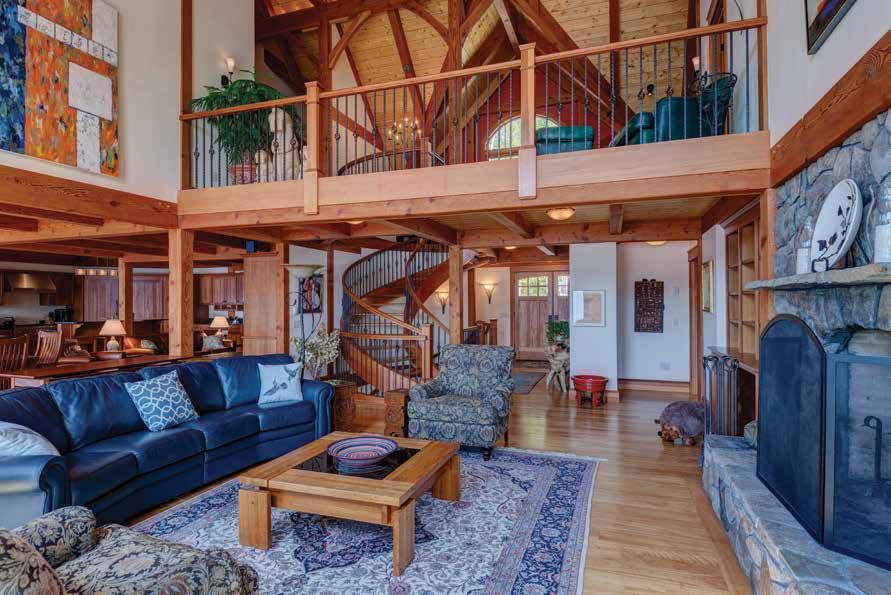 Lower-level living is just as comfortable as upstairs and features a stone fireplace, a custom wine room, and other beautiful spaces. The Timberpeg client tends to be highly discerning, Jim says.