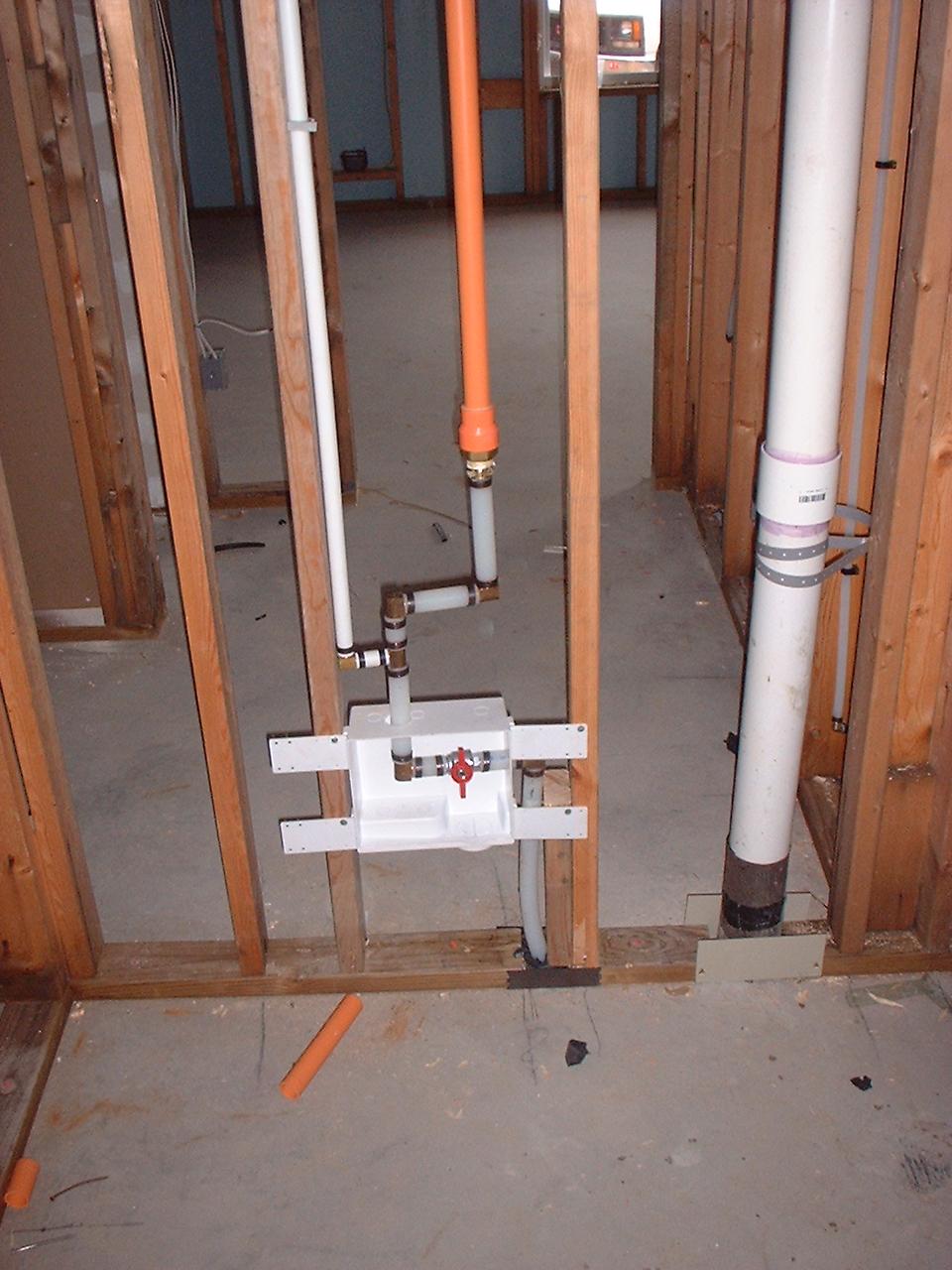Point of attachment of sprinkler system to domestic water entry To water heater